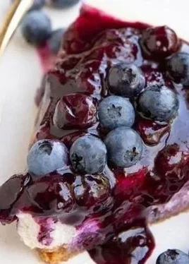 Blueberry Cottage Cheese Cheesecake topped with fresh blueberries