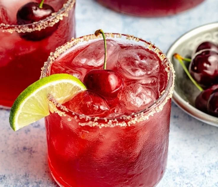 Delicious Cherry Limeade Cocktail with fresh cherries and lime slices