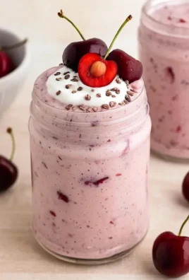 Delicious Cherry Overnight Oats topped with fresh cherries and almonds