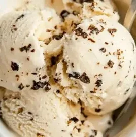 Delicious cottage cheese ice cream topped with fresh fruits and nuts.