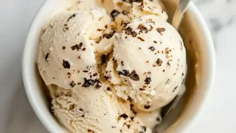 Delicious cottage cheese ice cream topped with fresh fruits and nuts.