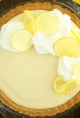 Slice of easy lemon cream pie with a creamy filling and lemon zest on top