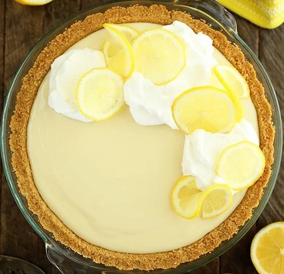 Slice of easy lemon cream pie with a creamy filling and lemon zest on top