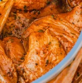 A bowl of easy Mexican chicken marinade with spices and herbs.