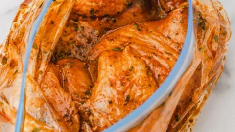 A bowl of easy Mexican chicken marinade with spices and herbs.