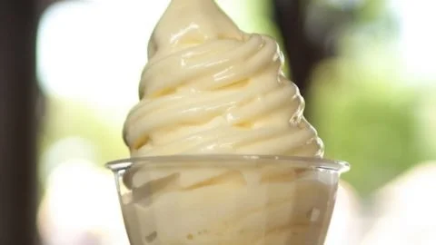 Delicious homemade Pineapple Dole Whip in a bowl with a pineapple slice