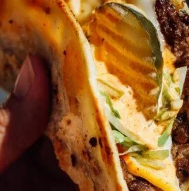 Delicious easy smash burger tacos served on a plate with toppings