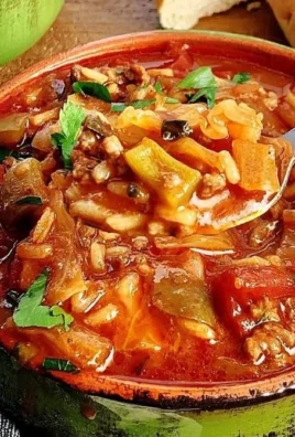 Bowl of easy stuffed cabbage soup garnished with fresh herbs