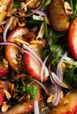 Delicious grilled peach salad featuring summer fruits and greens