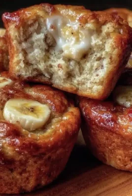 Healthy Greek yogurt banana muffins ready to eat, made with fresh ingredients.