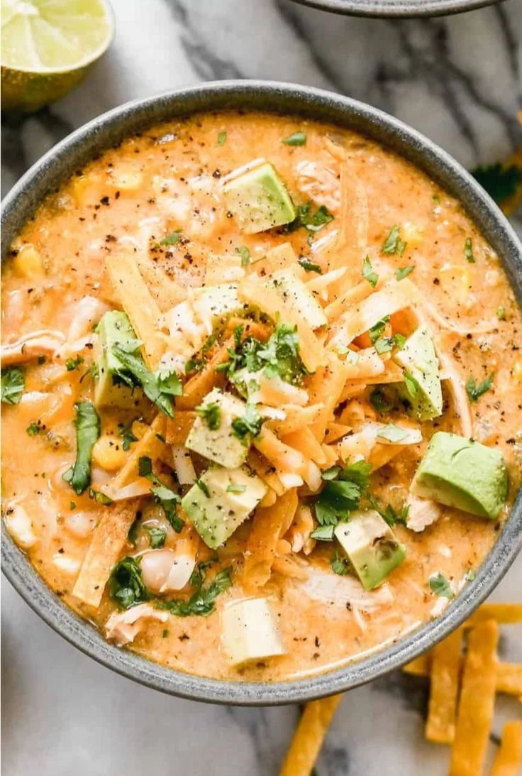 A bowl of healthy high protein white chicken chili garnished with cilantro.
