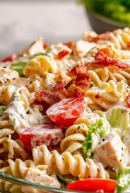 High Protein BLT Pasta Salad with bacon, lettuce, and tomatoes in pasta.