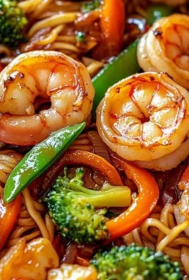 One-pan shrimp stir fry with noodles, highlighting delicious high-protein ingredients.