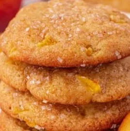 Freshly baked peach cookies on a cooling rack