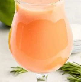 A refreshing glass of Peach Fresh Water with fresh peach slices.