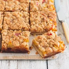 Delicious peaches and cream crumble bars with a golden crumble topping