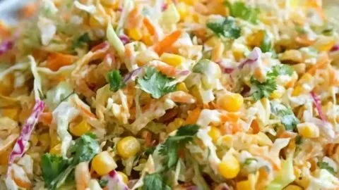 Deliciously vibrant spicy corn slaw served in a bowl during summer.
