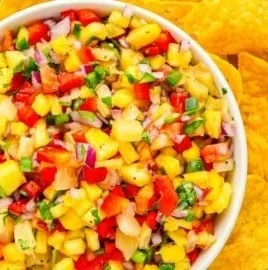 Bowl of spicy jalapeno pineapple salsa with fresh ingredients