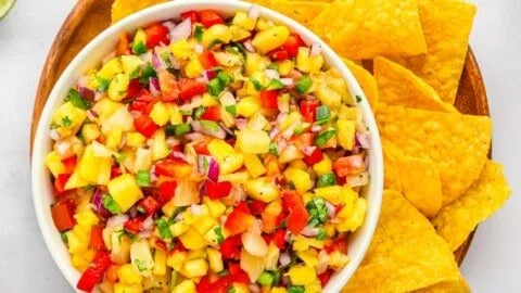 Bowl of spicy jalapeno pineapple salsa with fresh ingredients