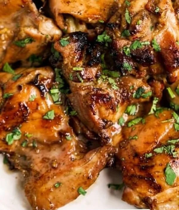 Deliciously marinated Thai grilled chicken served with fresh herbs and lime