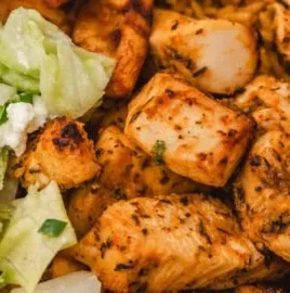 Juicy Air Fryer Greek Chicken seasoned with herbs and spices