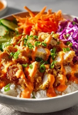 Delicious Bang Bang Chicken Bowl with crispy chicken, rice, and vegetables