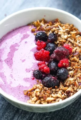 Berry whipped cottage cheese breakfast bowl topped with fresh berries.