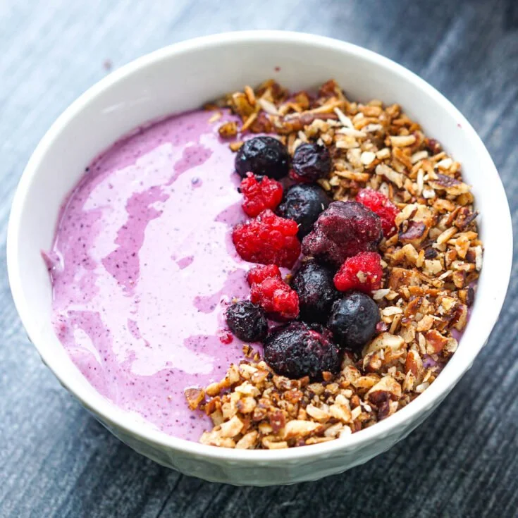 Berry whipped cottage cheese breakfast bowl topped with fresh berries.