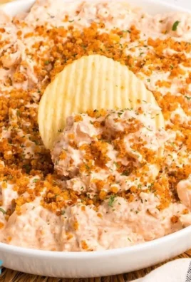 Delicious Bloomin’ Onion Dip served in a bowl with crunchy chips.