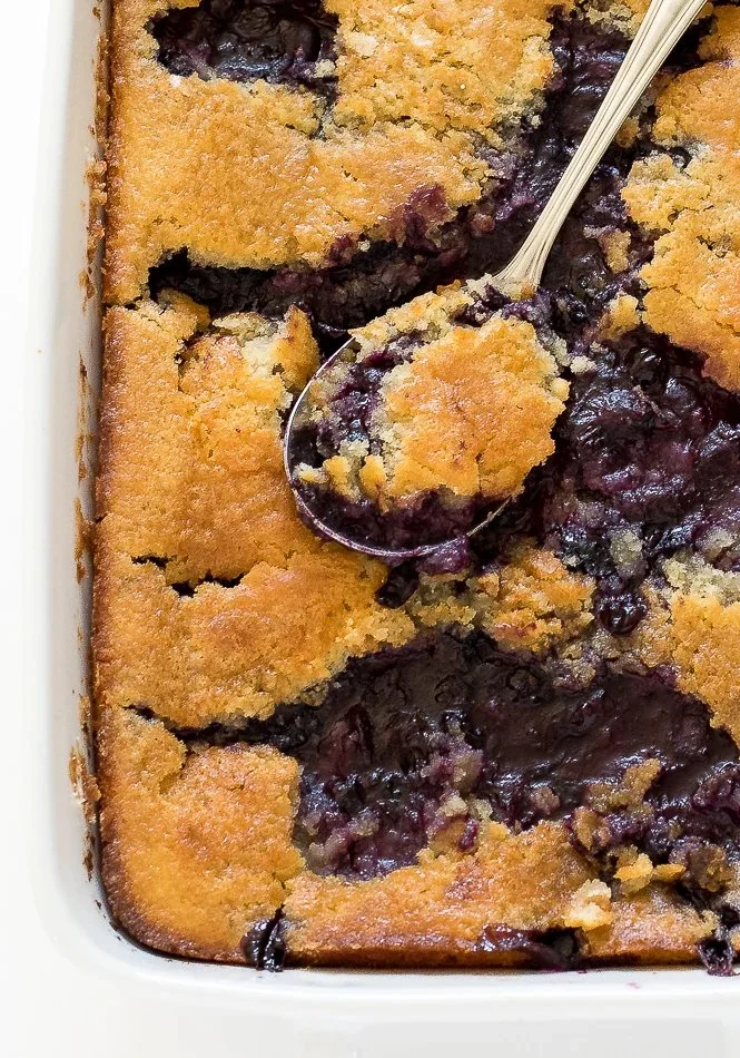 Delicious homemade blueberry cobbler with crispy topping and fresh blueberries