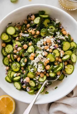 Bright cucumber chickpea salad with feta cheese and fresh vegetables.