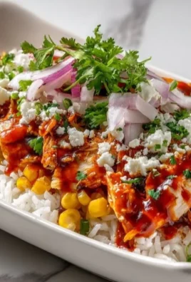 Delicious Buffalo Chicken Bowls with vibrant toppings and side ingredients.