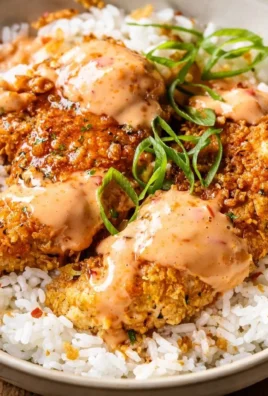 Cajun Chicken Rice Bowl topped with fresh vegetables and spices