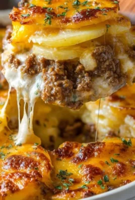 Cheesy Hamburger Potato Casserole garnished and ready to serve