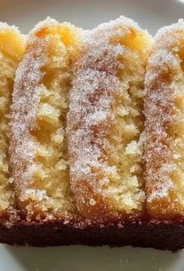 Fresh homemade cinnamon sugar donut bread, sliced and ready to serve.