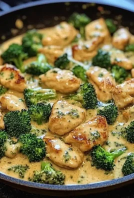 Creamy garlic chicken dish with broccoli in a skillet