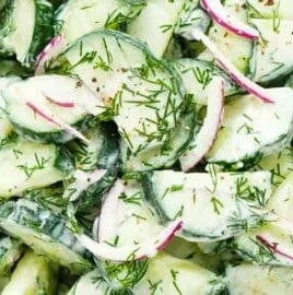 Fresh Cucumber Dill Salad served in a bowl with herbs and dressing