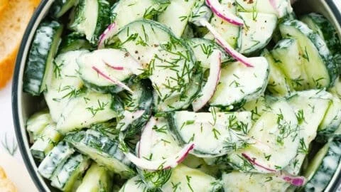 Fresh Cucumber Dill Salad served in a bowl with herbs and dressing