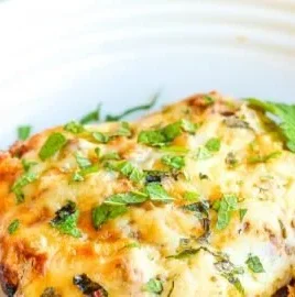 Low carb Mexican lazy cabbage roll casserole topped with cheese and spices