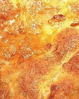 Delicious easy peach cobbler with fresh peaches and a golden crust