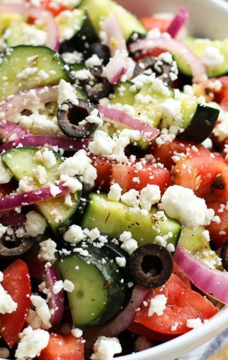 Fresh Greek Cucumber Salad with tomatoes, olives, and feta cheese