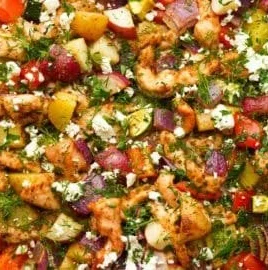 Delicious Greek Sheet Pan Chicken with colorful veggies ready to serve.