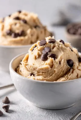 Bowl of Greek yogurt cookie dough with chocolate chips and a spoon