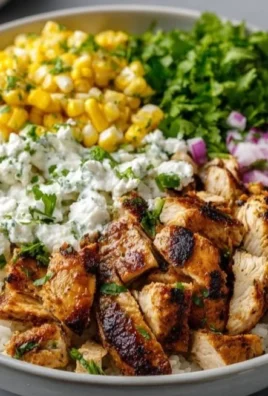 Grilled Chicken Bowl with cilantro lime rice and creamy Mexican street corn salad