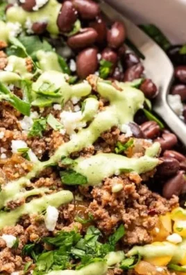 Ground beef taco salad bowl with fresh toppings and vibrant ingredients