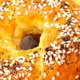 High protein bagels topped with cottage cheese and herbs for a healthy meal option.