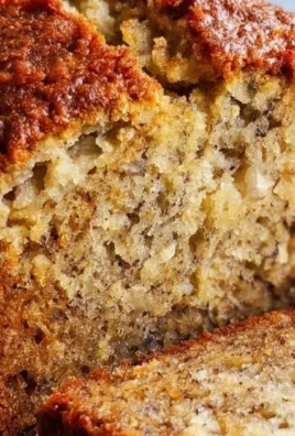 Freshly baked homemade banana bread on a wooden table