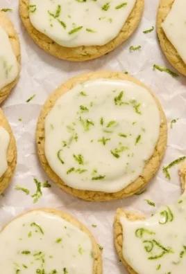 Plate of freshly baked Key Lime Cookies with a light green glaze.