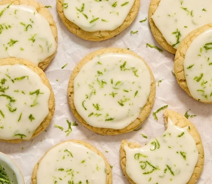 Plate of freshly baked Key Lime Cookies with a light green glaze.
