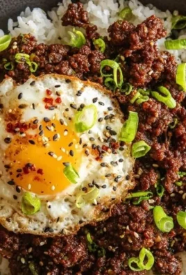 Korean Ground Beef Bowl garnished with green onions and sesame seeds